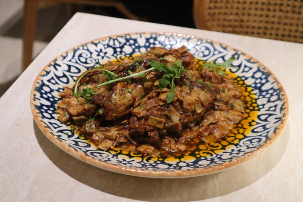 Rooster in Wine Sauce With traditional small Greek egg pasta